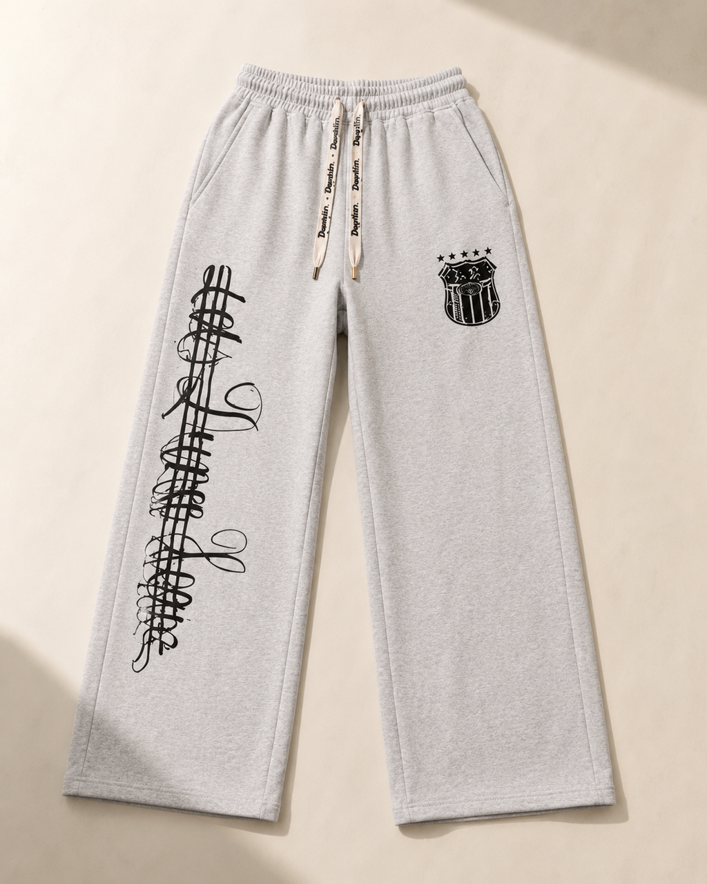 Auren Urban Script Wide-Leg Sweatpants flat lay
