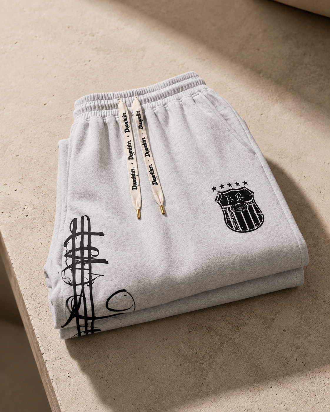 Auren Urban Script Wide-Leg Sweatpants folded product photograph